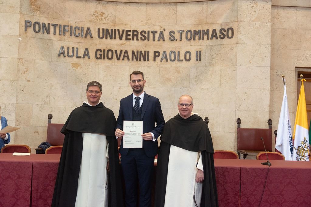Filip Veber at his licentiate graduation in the Aula Giovanni Paolo II at the Pontifical University of St. Thomas Aquinas, Rome, flanked by two Dominican friars